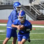 Adonai Garza takes a hand off during a practice drill. Ben Ray / The Reporter