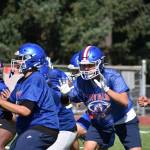 Kent-Meridian offensive line blocks during an offensive set. Ben Ray / The Reporter