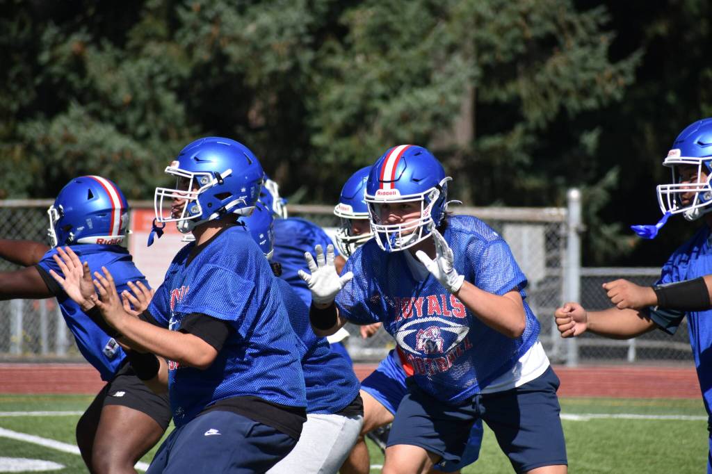 Kent-Meridian offensive line blocks during an offensive set. Ben Ray / The Reporter