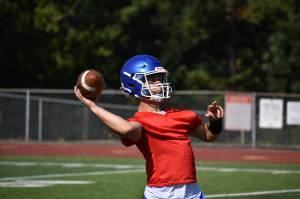 2024 Kent Reporter Athlete of the Year Sam Doma makes a pass for Kent-Meridian. Ben Ray / The Reporter