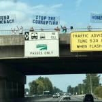 People protest along the South 277th Street overpass Sept. 1 on State Route 167 on the Kent/Auburn border. COURTESY PHOTO, Indivisible Auburn WA