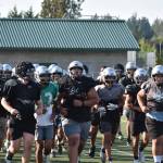 Kentwood players rally during team conditioning. Photo by Ben Ray/Sound Publishing