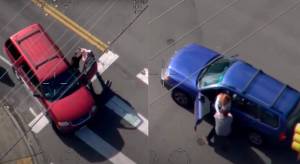 Ernesto Rojas-Renteria ripping people out of their cars in two different carjackings during the pursuit. Screenshot of Guardian One video.