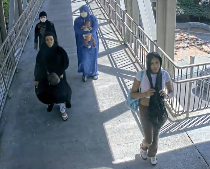 Reality Leavens in the bottom right alongisde other suspects after leaving Lululemon on Aug. 15, 2023. Screenshot from charging documents.