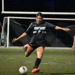 Reese Lee kicks the ball forward for Kentwood.