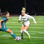 Makenna Bennett jukes a Raven defender at Auburn Riverside. Ben Ray / The Reporter