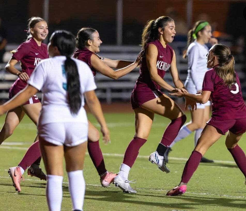 Kentlake celebrates Shannon McLains record setting goal. McLain (middle right) is surrounded by her teammates. Photo provided by Robby Mullikin.