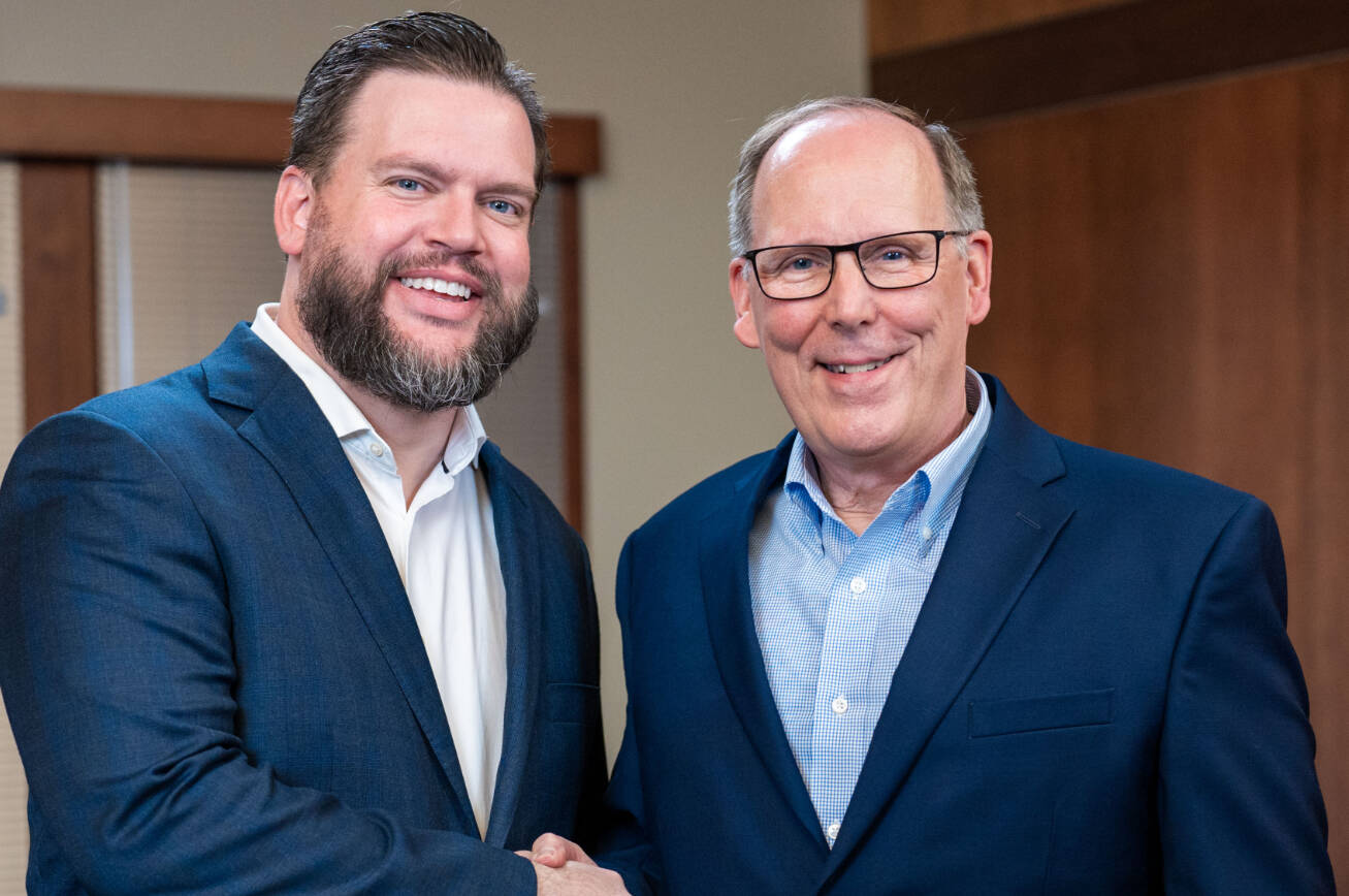 Geoff Bullock, president & CEO of Harborstone Credit Union, and Dan LeFree, president & CEO of Community 1st Credit Union. COURTESY PHOTO, Harborstone Credit Union