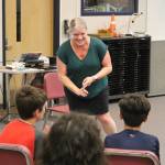 Colla Voce director Jackie Grant gleefully teaches her ensemble a mortifying warm-up. Photo by Bailey Jo Josie/Sound Publishing.