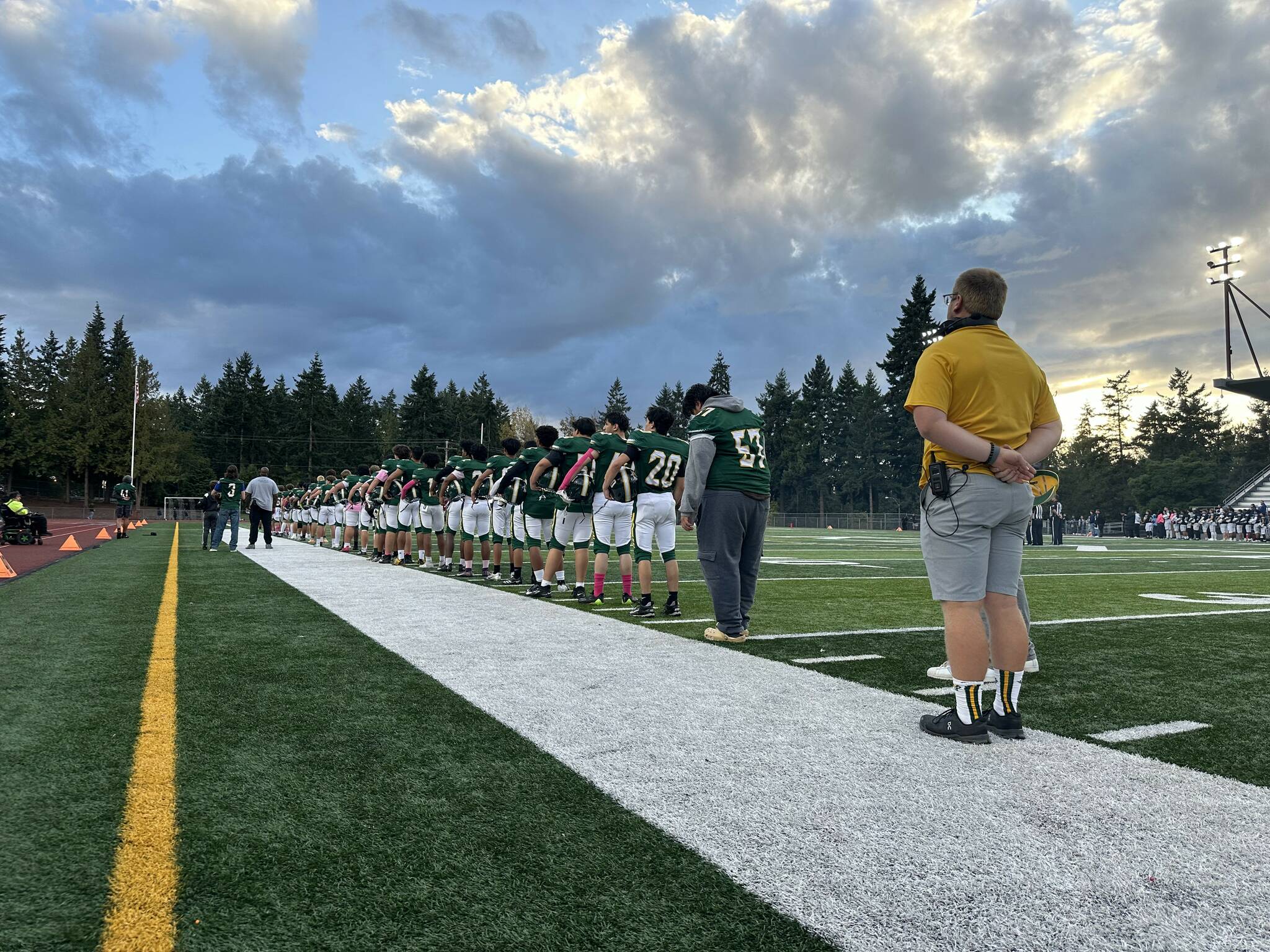 Kentridge football team stands for the national anthem. Photo provided by Nathan Hyun