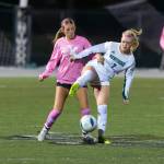 Makenna Bennett fights for possession against Kentwood. Photo by Robby Mullikin