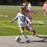 Natalia Krall-Cruz kicks the ball out of bounds defending in the first half. Photo by Robby Mullikin