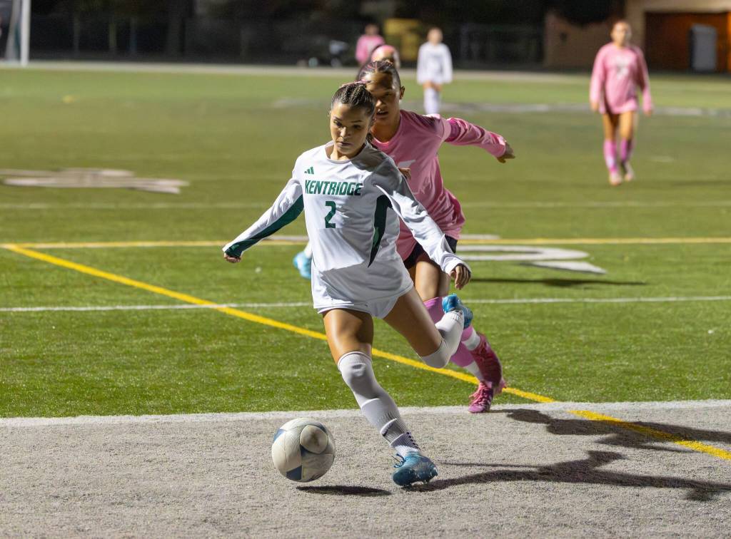 Natalia Krall-Cruz kicks the ball out of bounds defending in the first half. Photo by Robby Mullikin