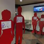 Silhouettes fill the lobby of Renton City Hall, telling the stories of Renton residents who have lost their lives due to domestic violence.