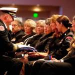 The flag presentation to Pam Webb, the wife of Puget Sound Fire Deputy Chief Jimmy Webb, during a Celebration of Life service Oct. 4 at Christian Faith Center in Federal Way. COURTESY PHOTO, Puget Sound Fire