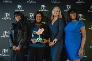 Founder Miny Tefesse accepted the Minority-Owned Small Business of the Year award on behalf of Abyssinia Beauty School.