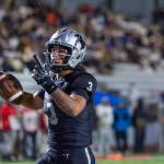 On his third touchdown of the night, Darian Williams points to the sky. Photo by Robby Mullikin