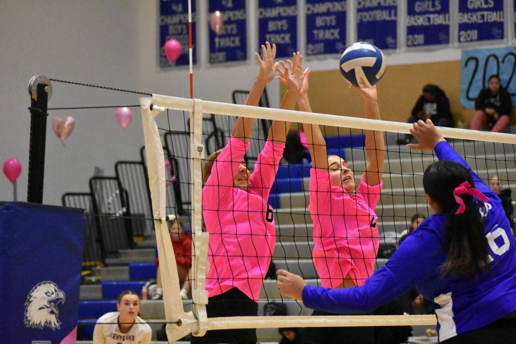 Ryann Smith (left) and Mattea Finseth (right) go up for the block. Ben Ray / The Reporter