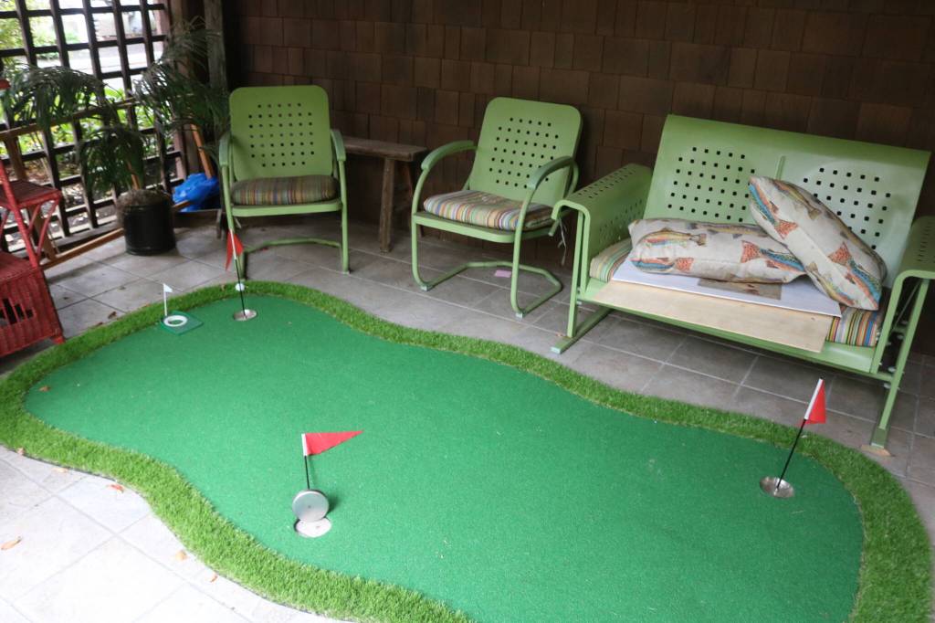 Two residents like to play mini golf so a small green was put in one of the facilitys sun rooms. Photo by Bailey Jo Josie/Sound Publishing.