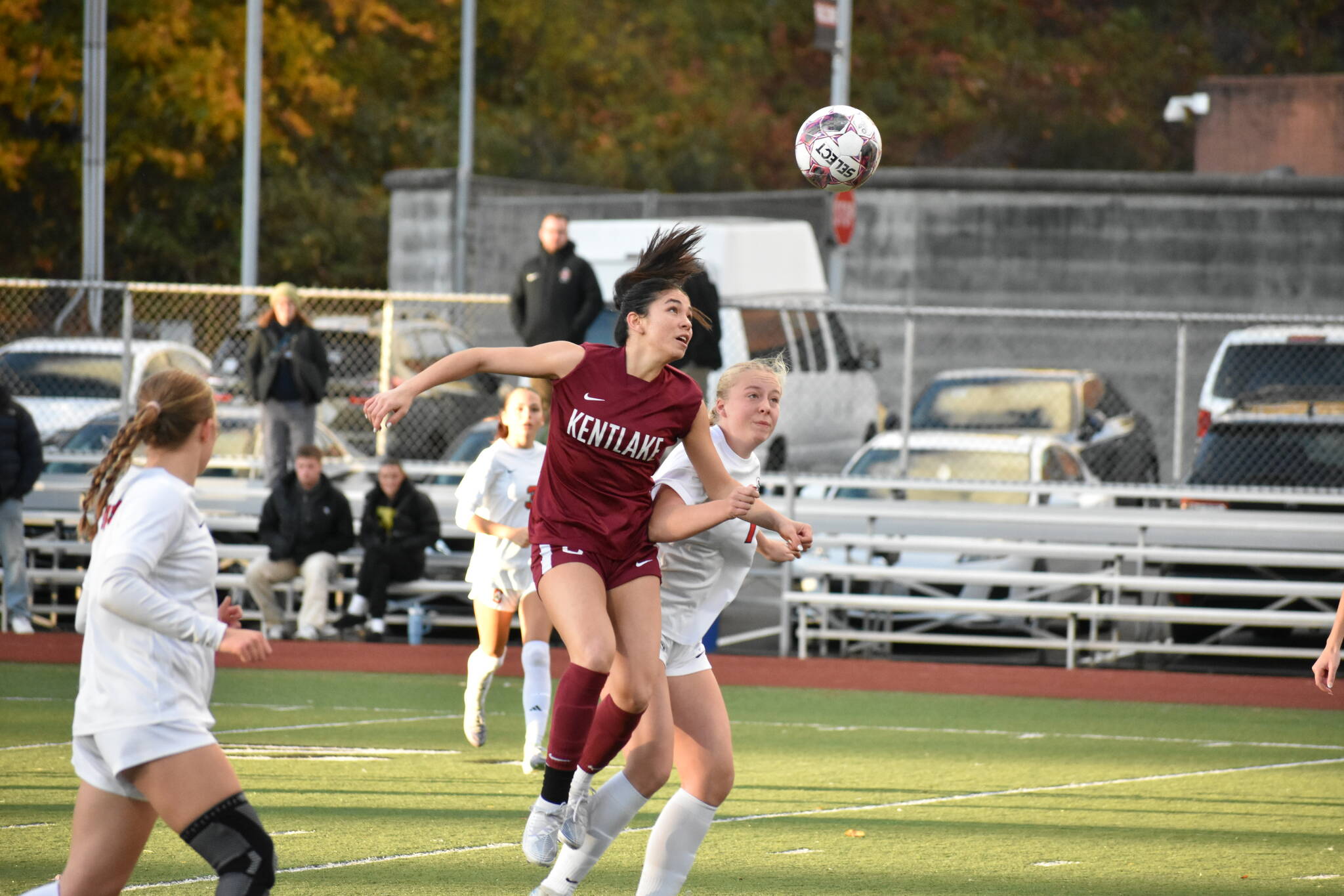 Shannon Mclain heads the ball for Kentlake against Silas. Ben Ray / The Reporter