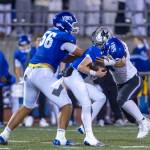 Kentwood defender records a tackle against Curtis. Photo provided by Robby Mullikin