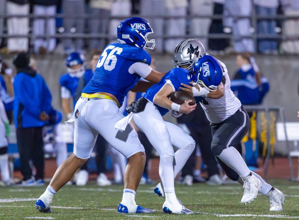 Kentwood defender records a tackle against Curtis. Photo provided by Robby Mullikin