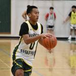 Troy Keowla dribbles down the floor during a fast break drill. Ben Ray / The Reporter