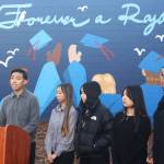 Kevin Cruz, Kent-Meridian High School student body president, speaks Nov. 24 during a gathering to unveil a new mural at the school near the gym to honor students and staff who have died. STEVE HUNTER, Kent Reporter