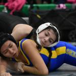 Karina Quebrado from Kentwood wrestles in her home gym. Ben Ray / The Reporter