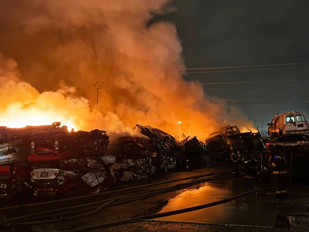 COURTESY PHOTO, Puget Sound Fire
A fire burns crushed and stacked vehicles Sunday, March 16 at Binford Auto Wrecking, in the 26200 block of 78th Ave. S., in Kent.