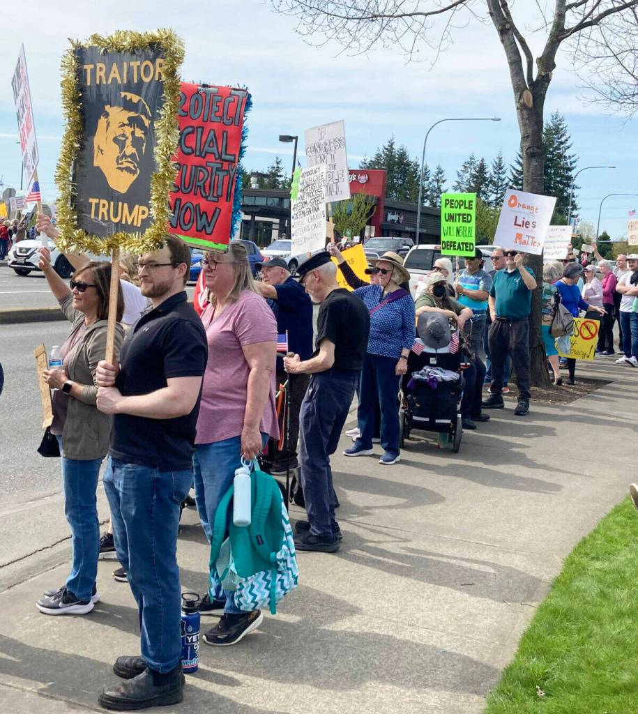 Protesters line SE 272nd Street April 5 in Covington against actions by the Trump administration.
COURTESY PHOTO, Ron Auerbach