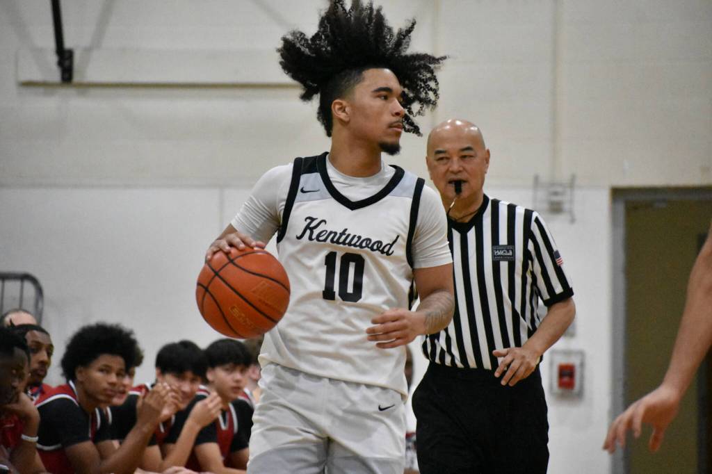 Darian Williams holds up play while looking for a teammate. Ben Ray / The Reporter