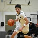 Brandon Tagle turns the corner with the ball in his hand against Kennedy Catholic. Ben Ray / The Reporter