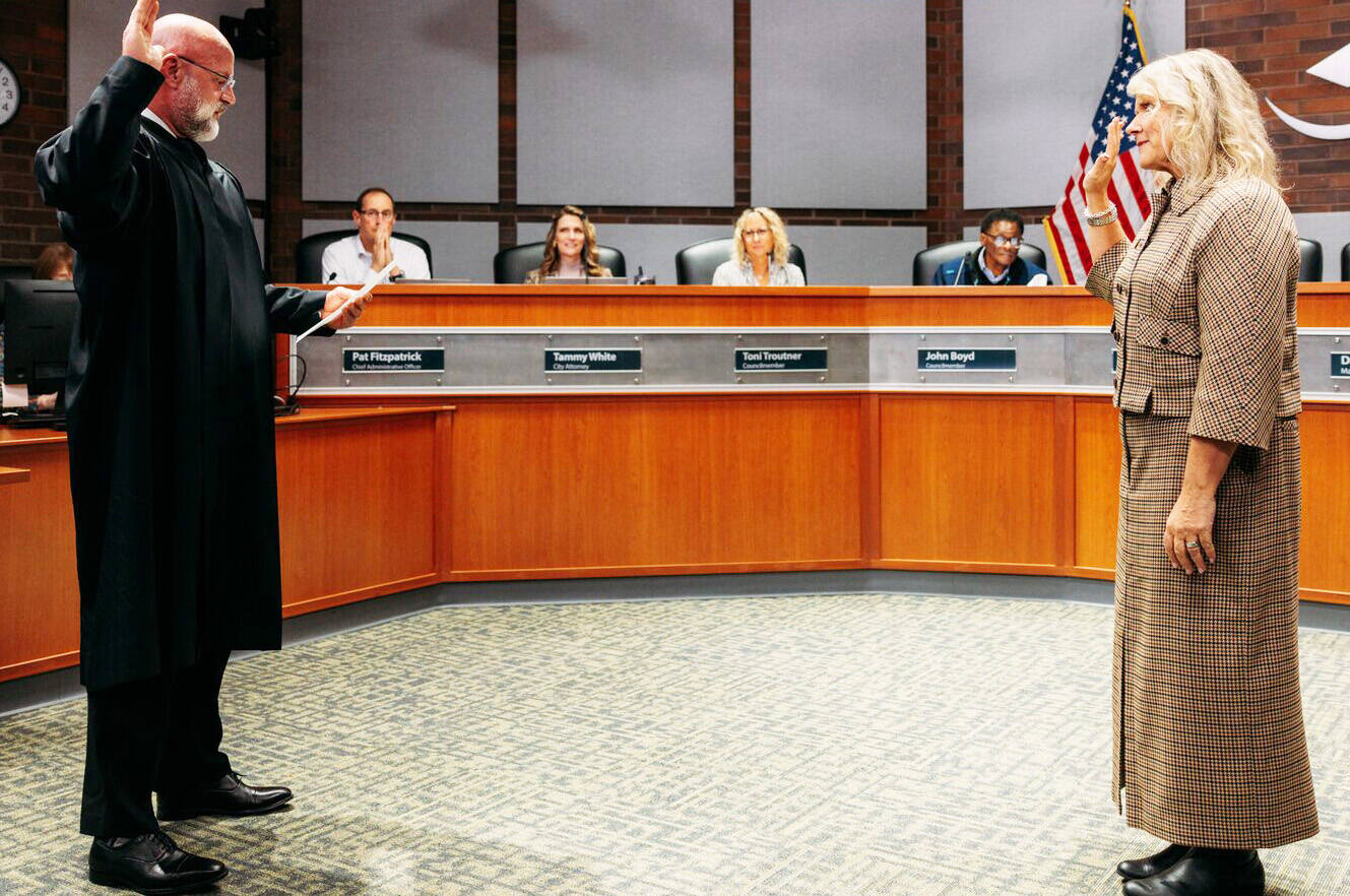 Kent Municipal Court Judge Michael Frans swears in Mayor Dana Ralph during the Jan. 6 City Council meeting. COURTESY PHOTO, City of Kent
