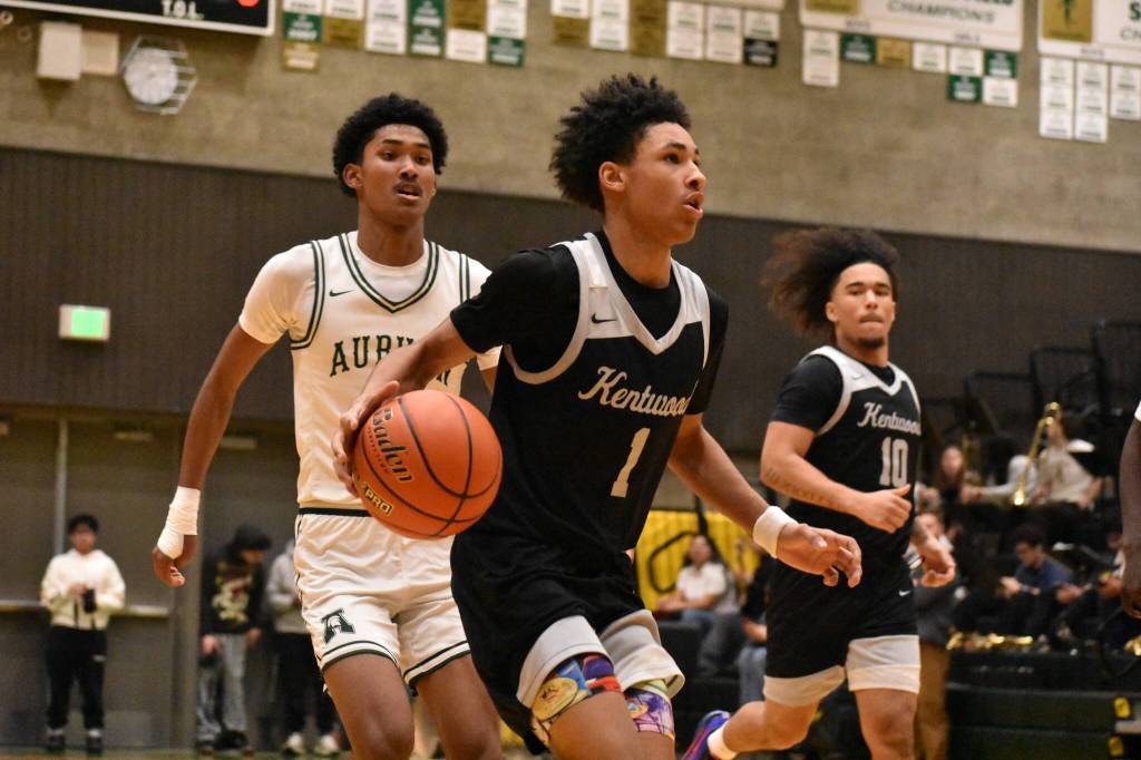 Bryson Manaway drives to the basket for Kentwood. Ben Ray / The Reporter