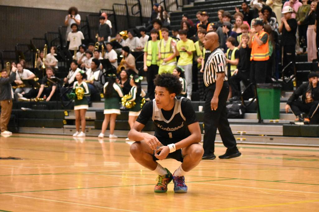 Bryson Manaway sits in disbelief after missing a shot for Kentwood. Ben Ray / The Reporter