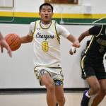 Troy Keowla dribbles the ball up the floor for Kentridge against Auburn. Ben Ray / The Reporter
