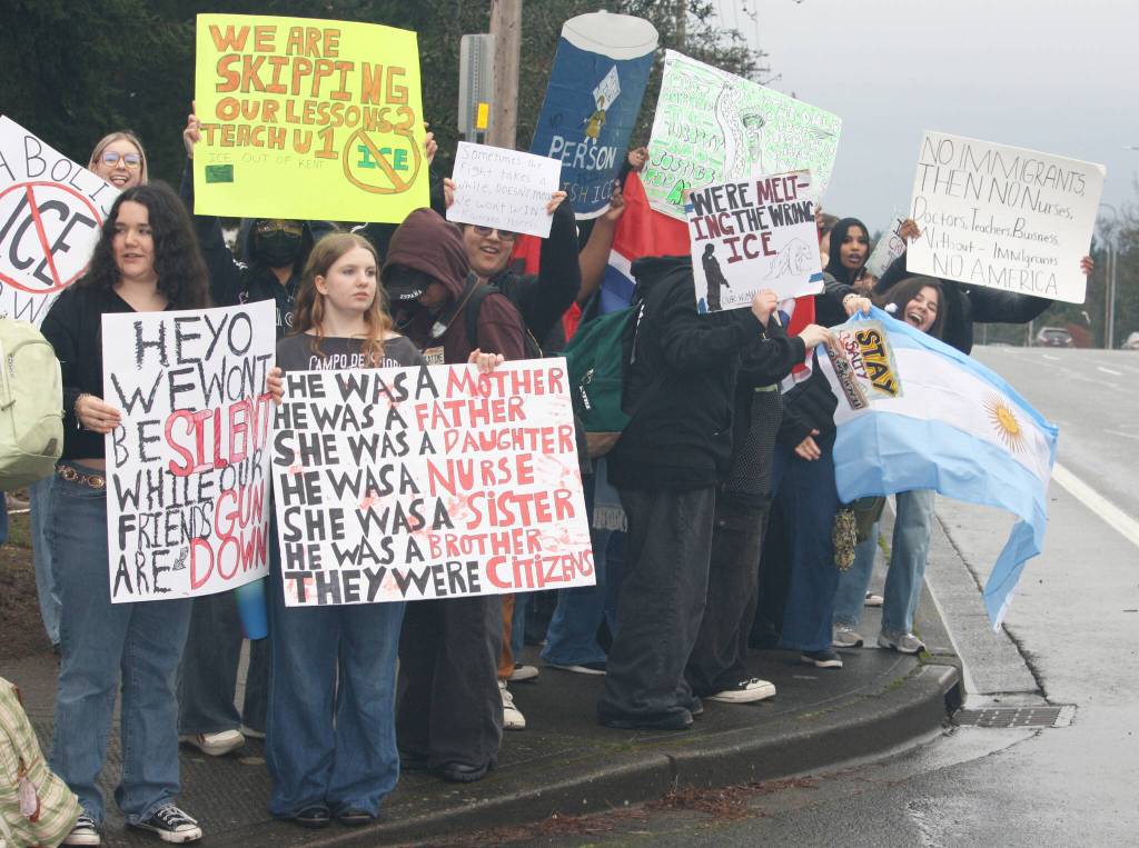 Students pack a sidewalk to display their signs outside of Kentridge High School. STEVE HUNTER, Kent Reporter