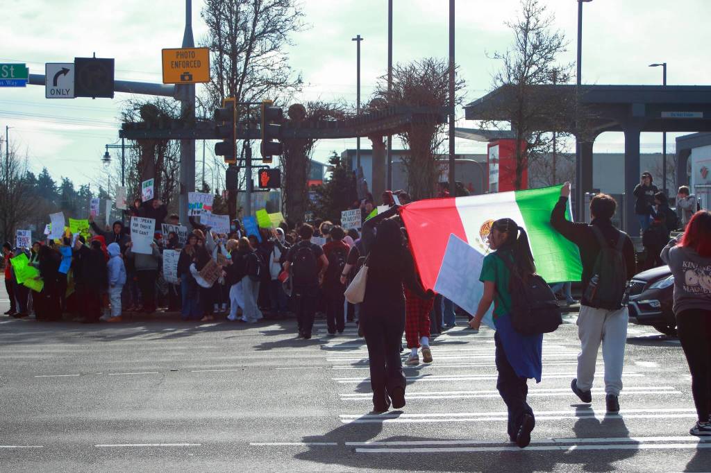 Students shared their cultural pride through flags and signs during a demonstration against ICE on Feb. 5. Photo by Keelin Everly-Lang / the Mirror