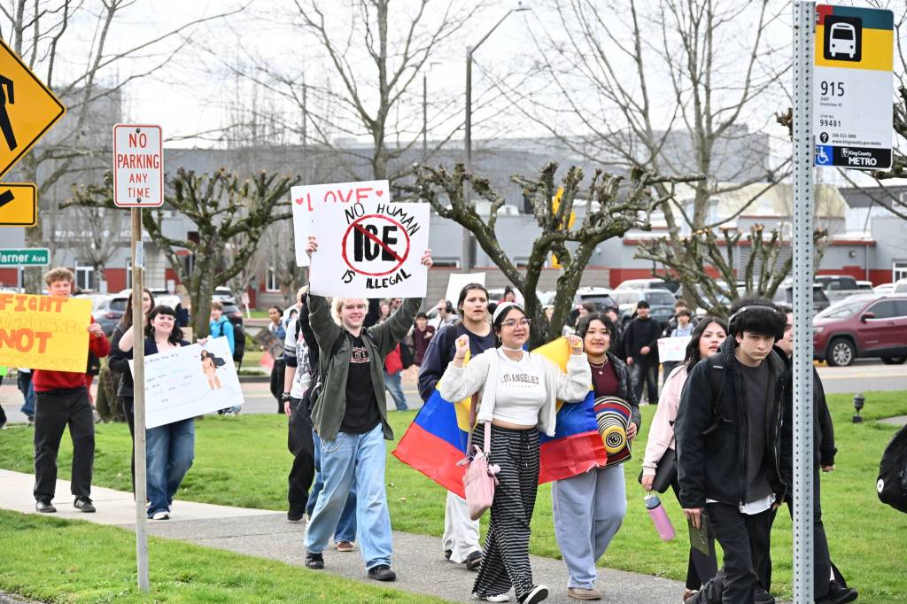 Students walked more than a mile and a half from Enumclaw High to city hall. Photo by Ray Miller-Still