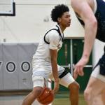 Bryson Manaway dribbles the ball between his legs for Kentwood. Ben Ray / The Reporter