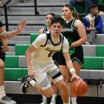 Brandon Tagle drives to the basket for Kentwood. Ben Ray / The Reporter