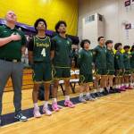 Kentridge Chargers stand for national anthem at Puyallup High School. Nathan Hyun / for The Reporter