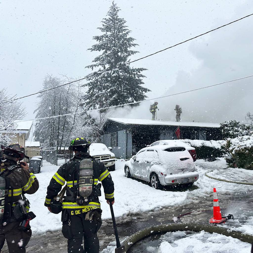 Firefighters put out a fire at a single-story house March 13 in the 11800 block of SE 274th St. in Kent. COURTESY PHOTO, Puget Sound Fire