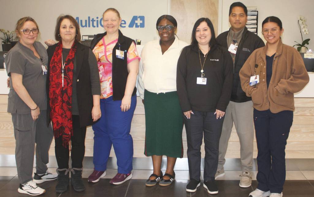 MultiCare Lake Meridian employees from left to right: Bridget Boreson, medical assistant; Maria Cook, clinic manager; Sarah Cerrato-Centeno, medical assistant; Erakwandra Joseph, health care worker; Kaylee Kosinski, receptionist; Marlon Agraan, RN care manager; and Erin Levinia Luar, medical assistant.