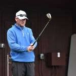 Brian Thornton eyes down the driving range during a lesson. Ben Ray /The Reporter