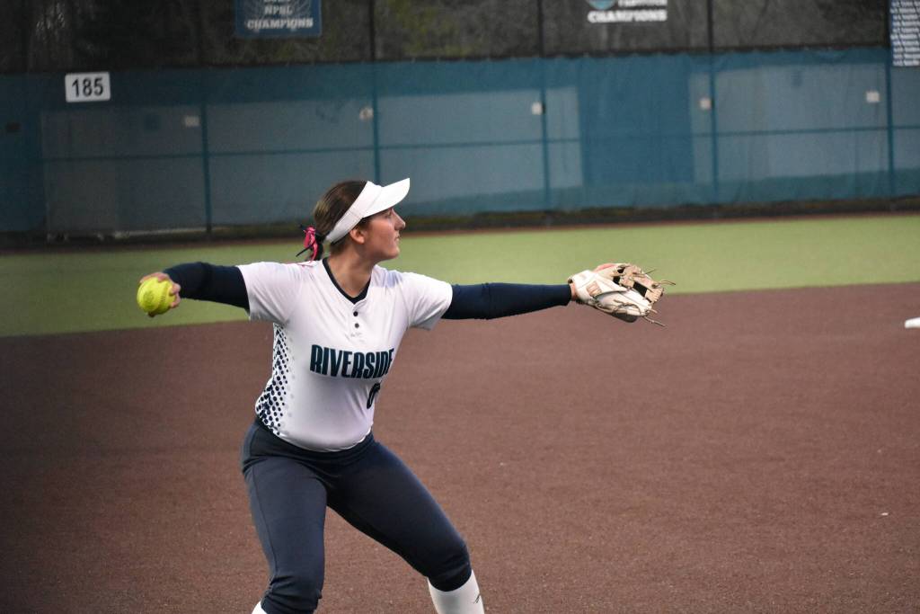 Katelyn Taylor makes a throw across the infield for Auburn Riverside. Ben Ray / The Reporter