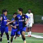 Delano Valerio gets a high five from his teammates after scoring the games first goal. Ben Ray / The Reporter