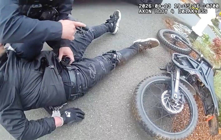 Kent Police arrest a man on an electric bike for several charges on April 13 along SE 248th Street near the Kent YMCA. COURTESY PHOTO, Kent Police