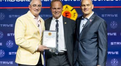 Greg Markley, center, of Puget Sound Fire, receives an International Association of Fire Fighters leadership award. COURTESY PHOTO, Puget Sound Fire